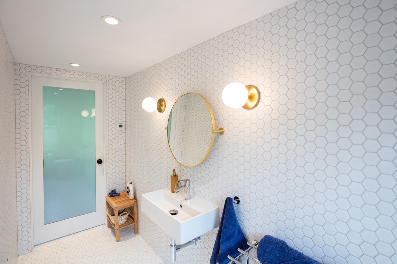 view of first floor bathroom facing sink, mirror.